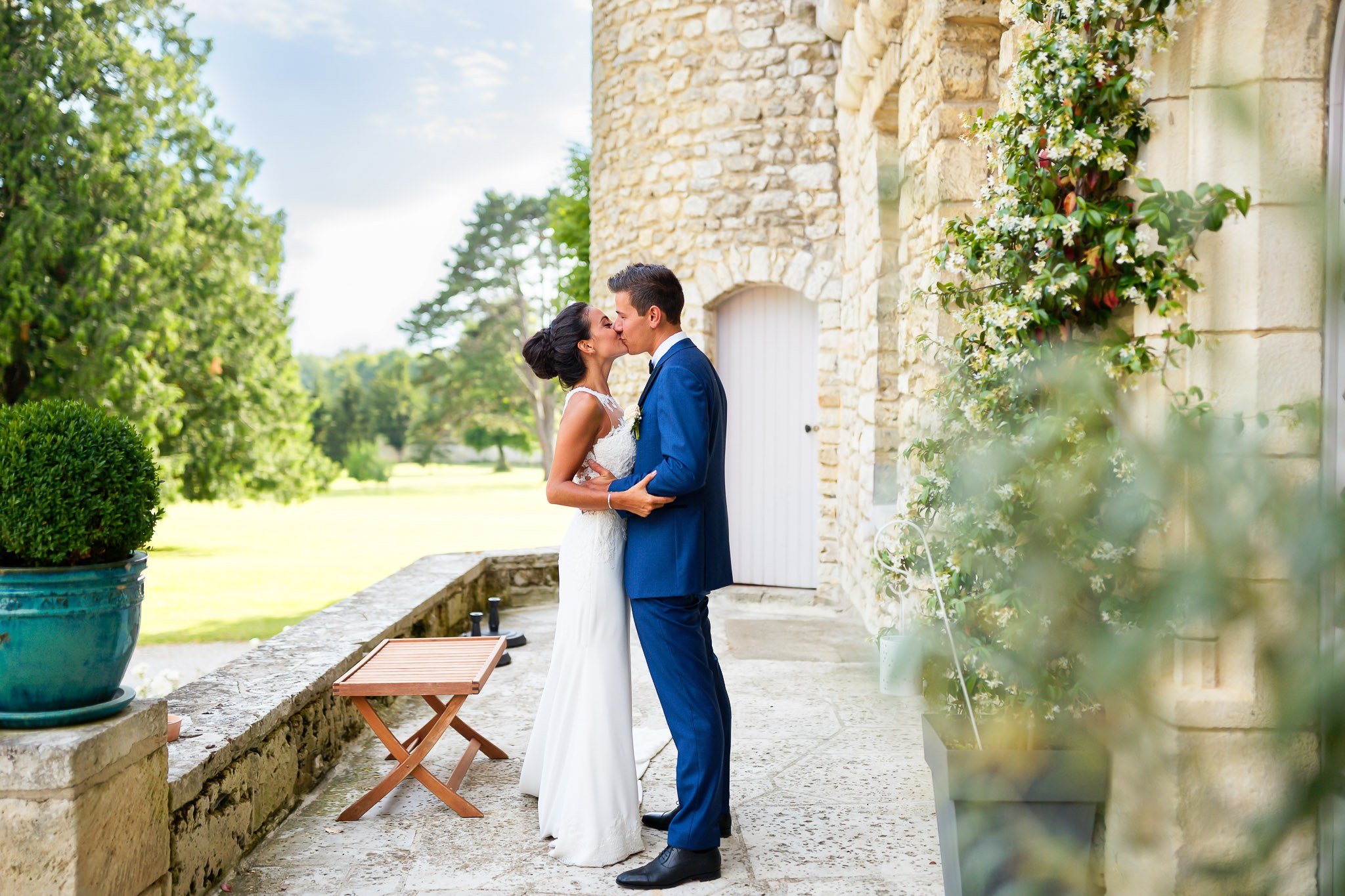 Passionate Wedding Kiss on Historic Stone Terrace