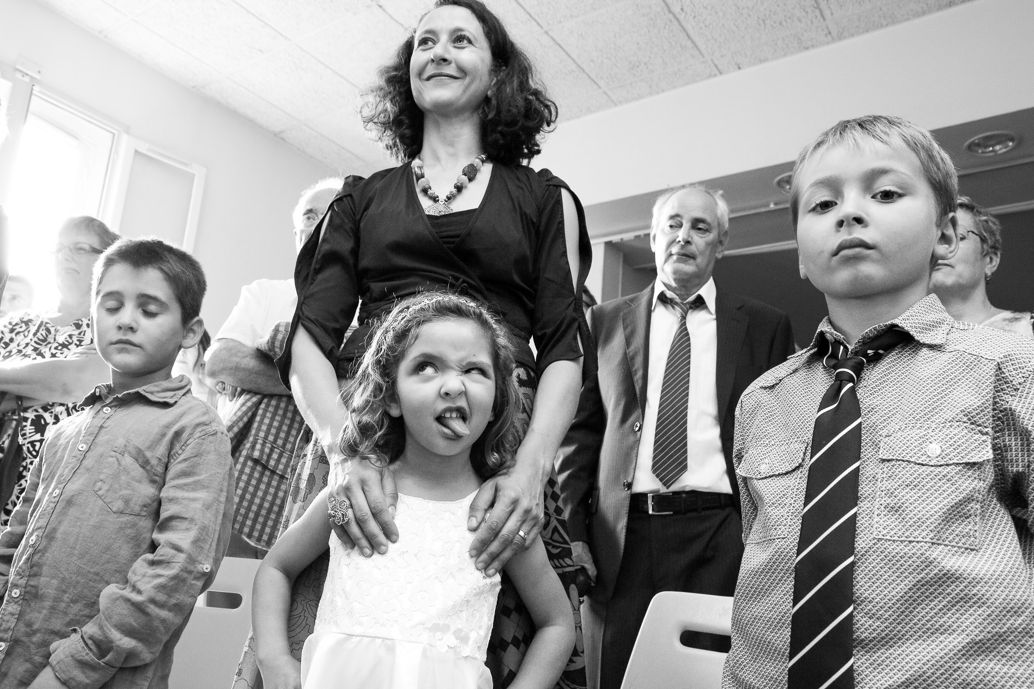 Child Makes Silly Face During Courthouse Wedding Ceremony