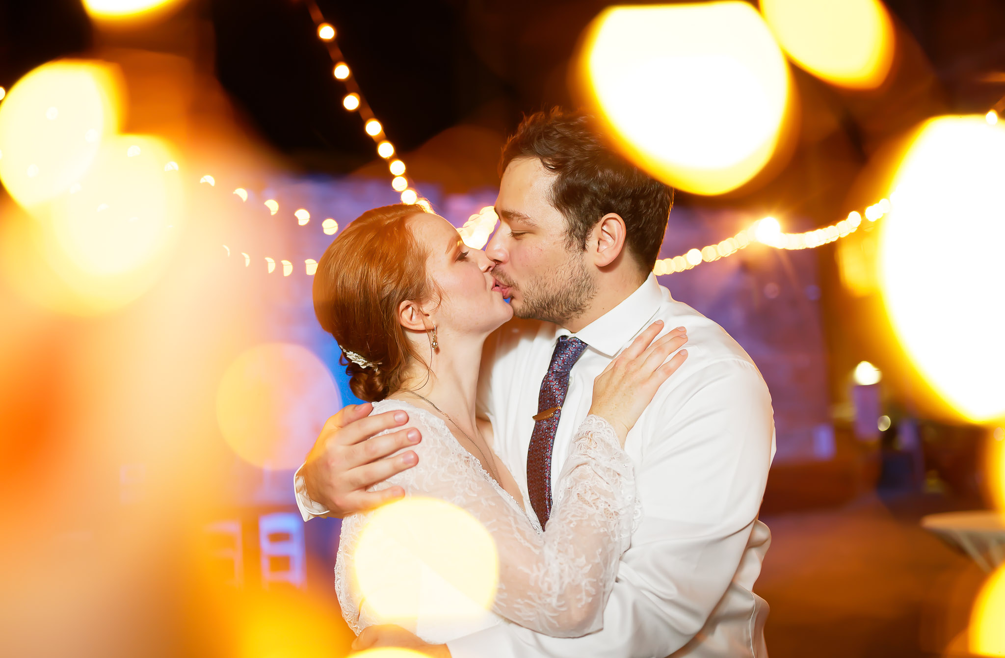 Creative Wedding Kiss Photo with Fairy Lights and Bokeh