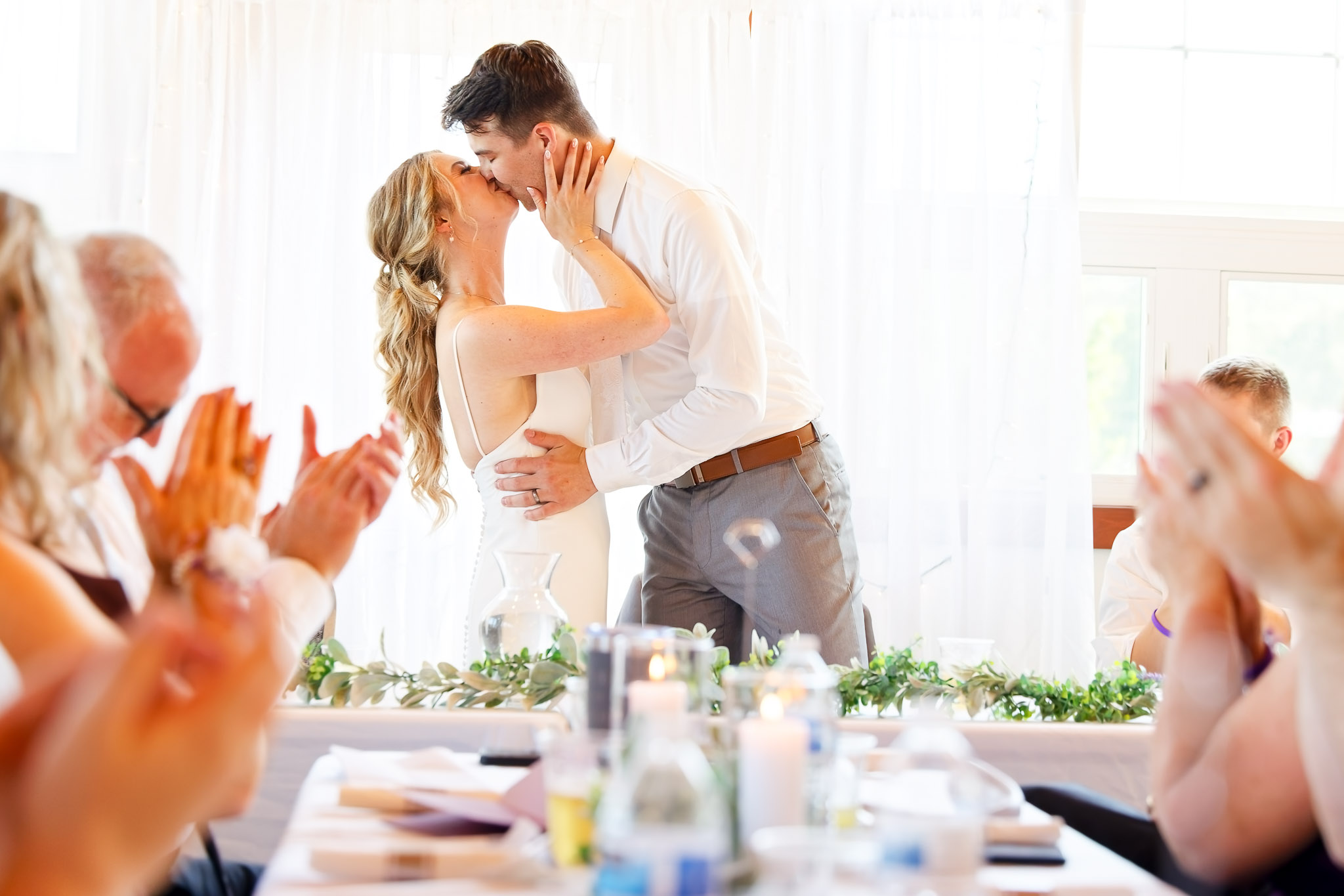 Wedding Toast Kiss at Bearwood Event Barn Byron Minnesota