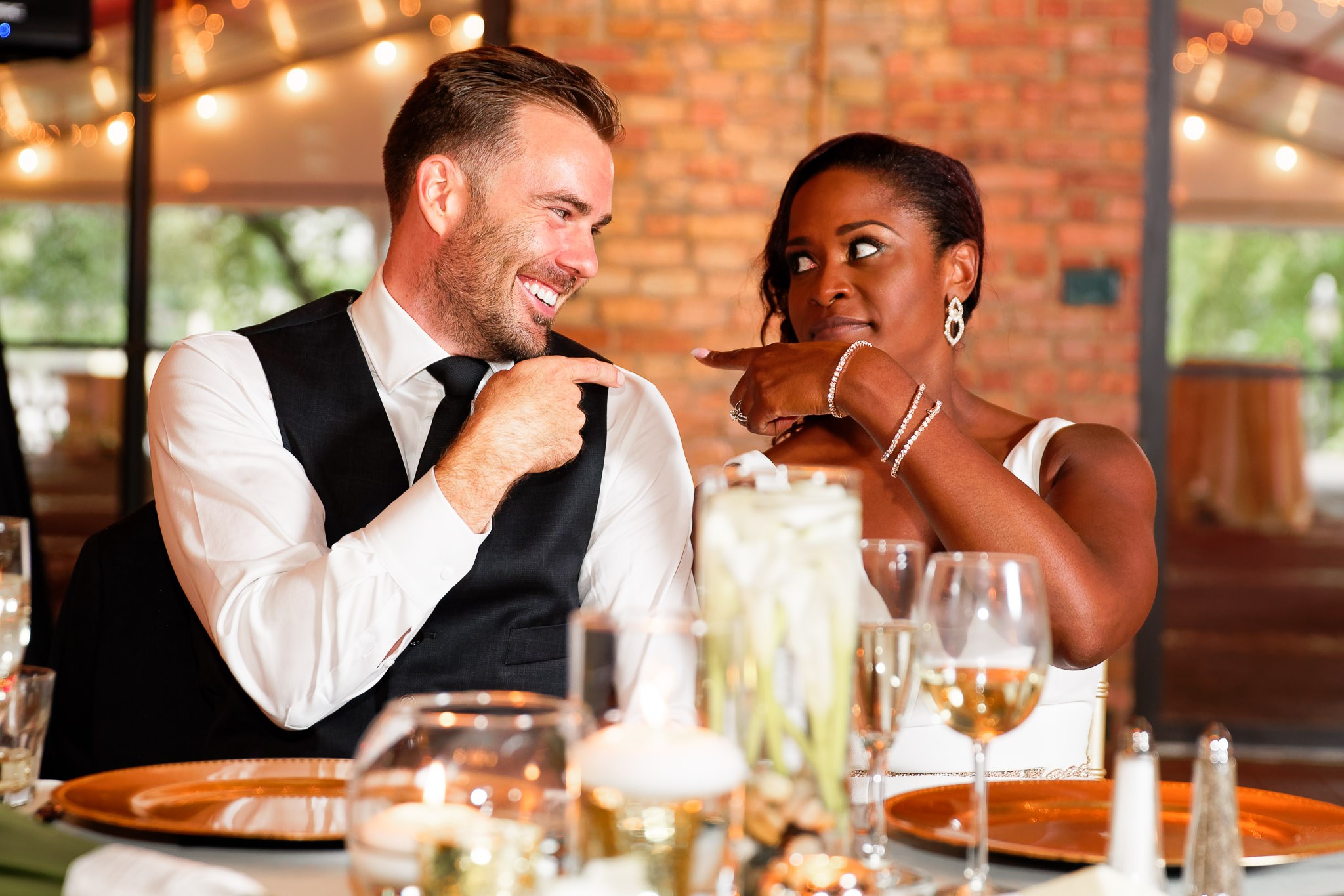 Bride and Groom Playful Moment During Wedding Reception Speech