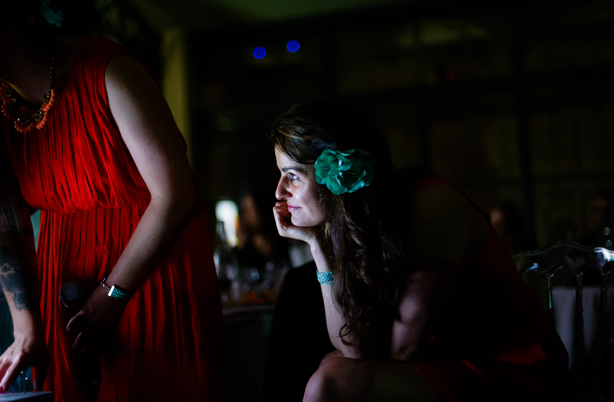 Bridesmaid Lit by Video Projection at Wedding Reception
