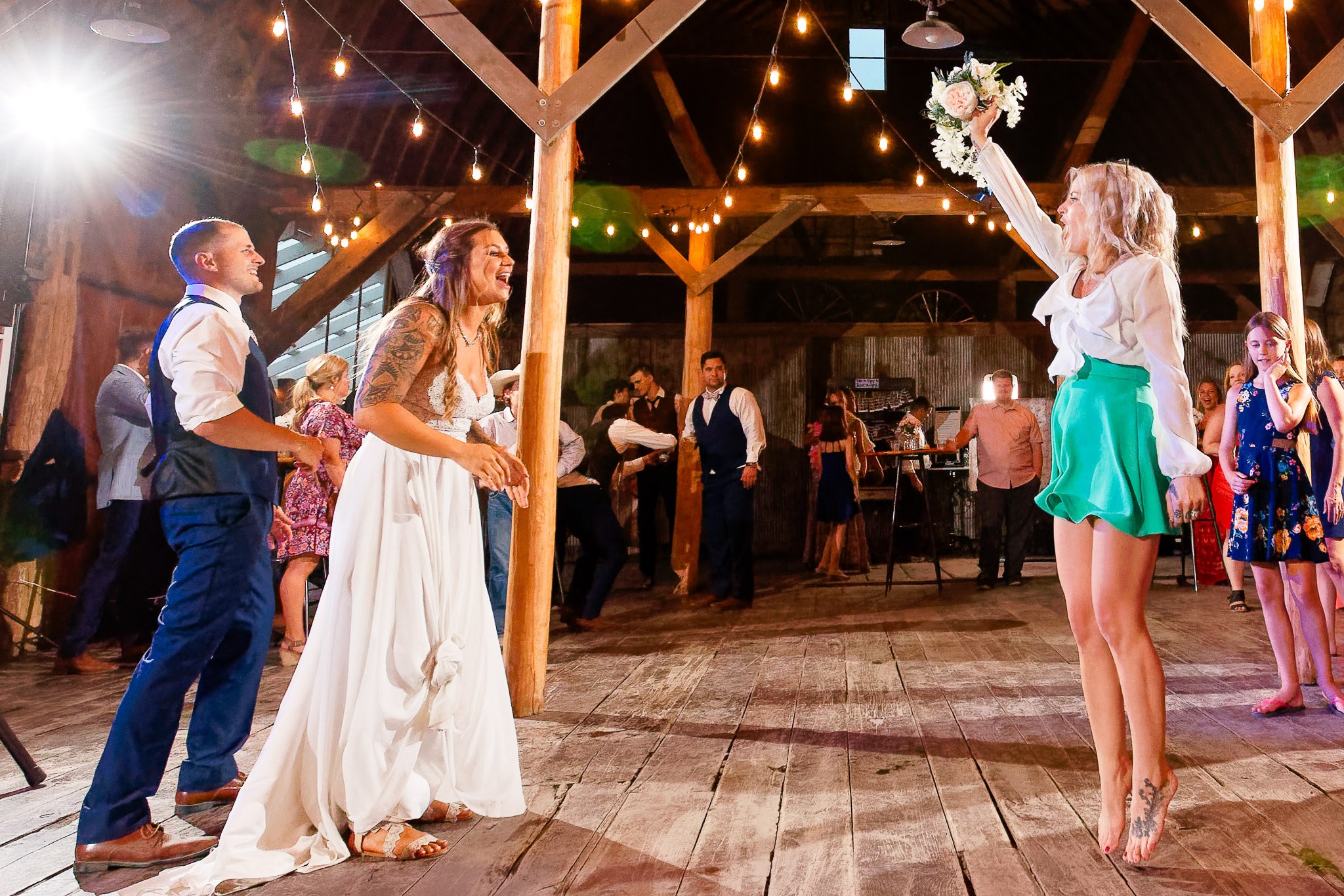 Bouquet Toss Catch at Maple Ridge Farm Barn Wedding Reception