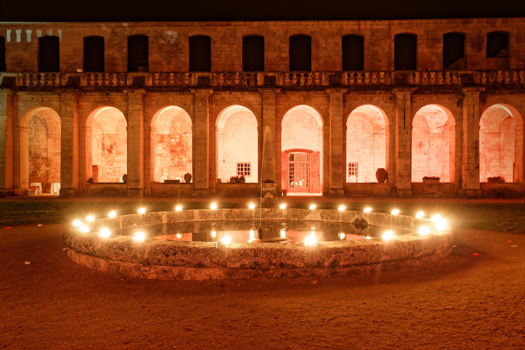 Historic Wedding Venue Night Lighting with Stone Arches