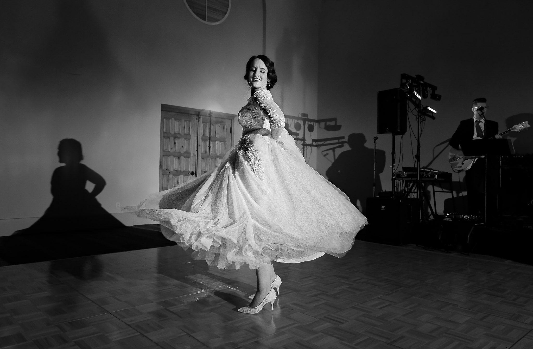 Bride Dancing in Flowing Dress During Wedding Reception