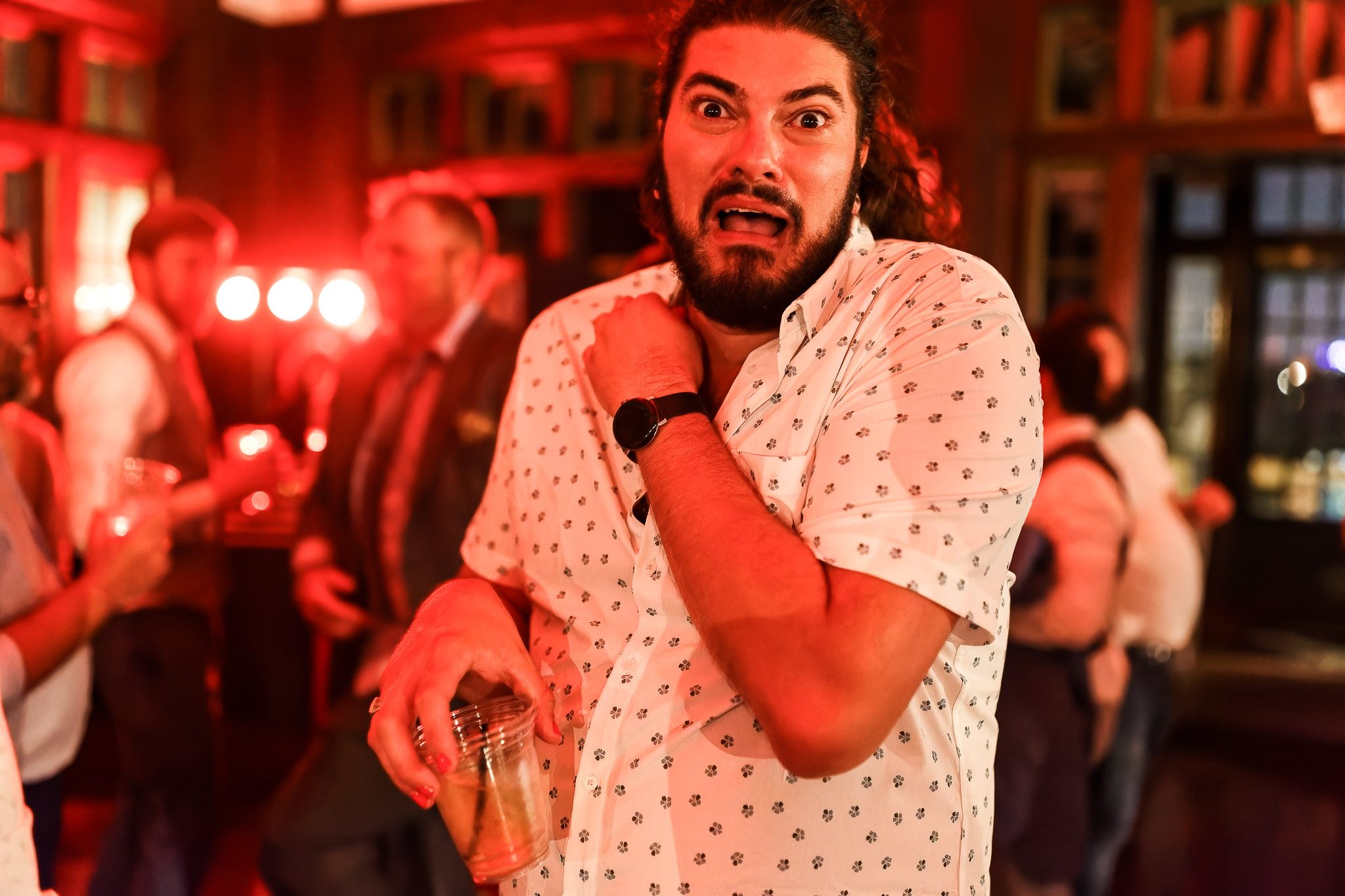 Guest Pretends to be Scared by Photographer at Wedding Reception