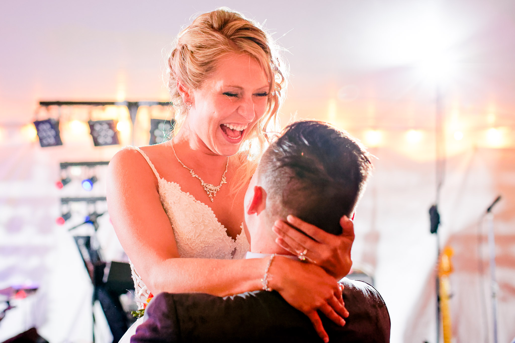 Groom Lifting Bride During Wedding Reception Dance