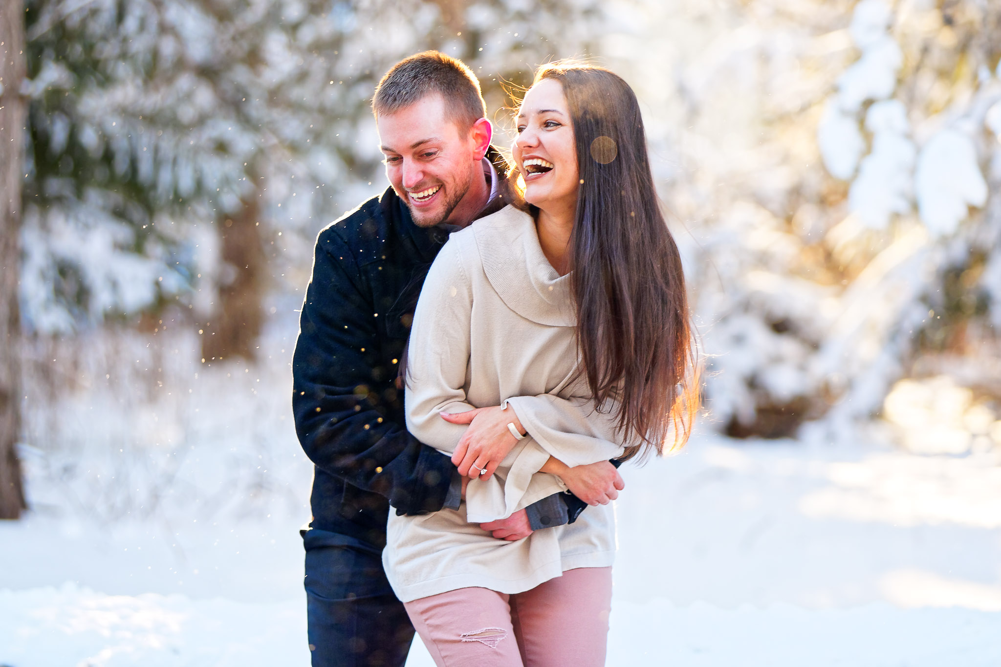 Winter Engagement Photos - Same-Sex Couple in Snowy Forest