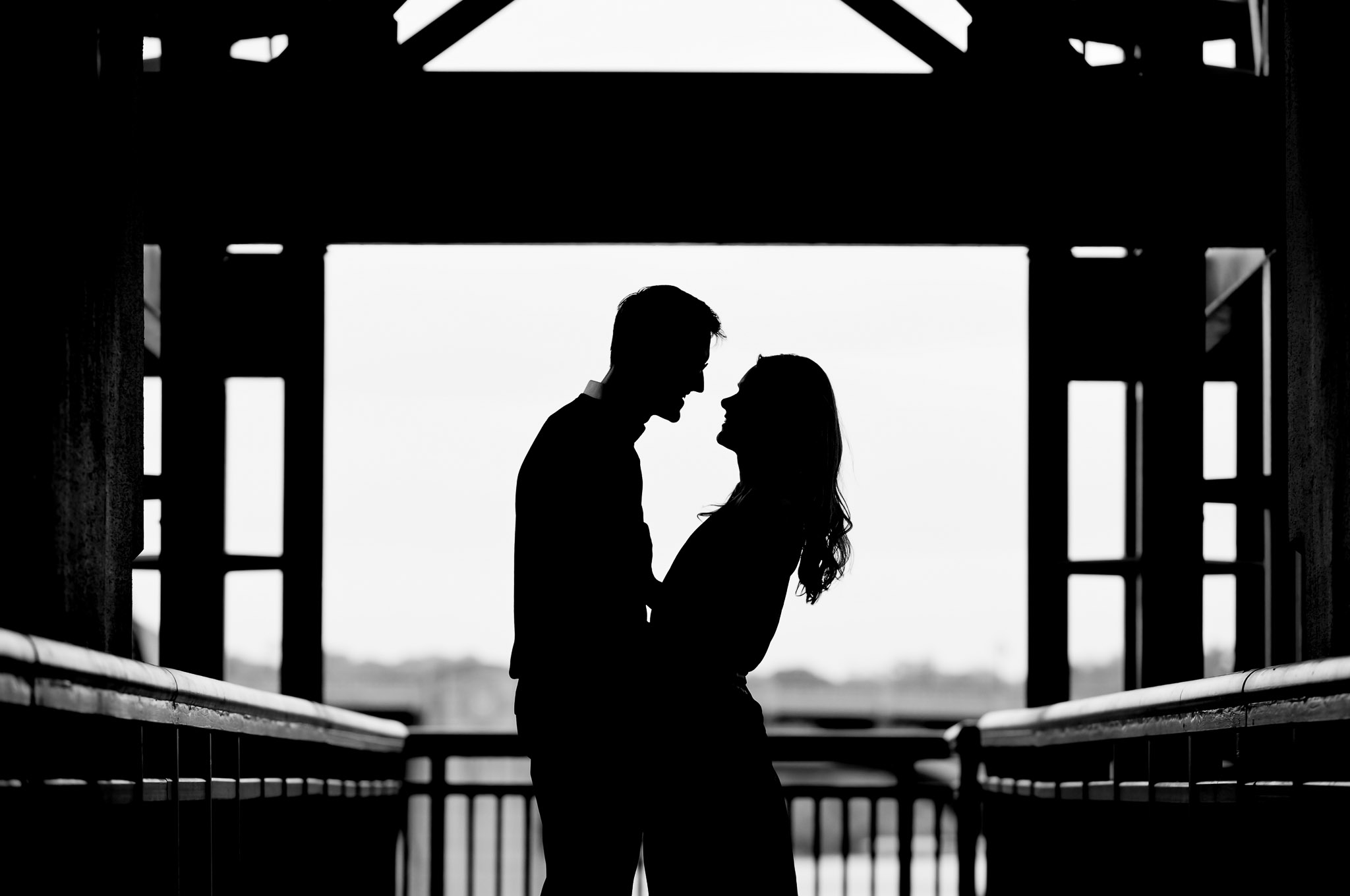 Romantic Engagement Silhouette Portrait on Covered Bridge