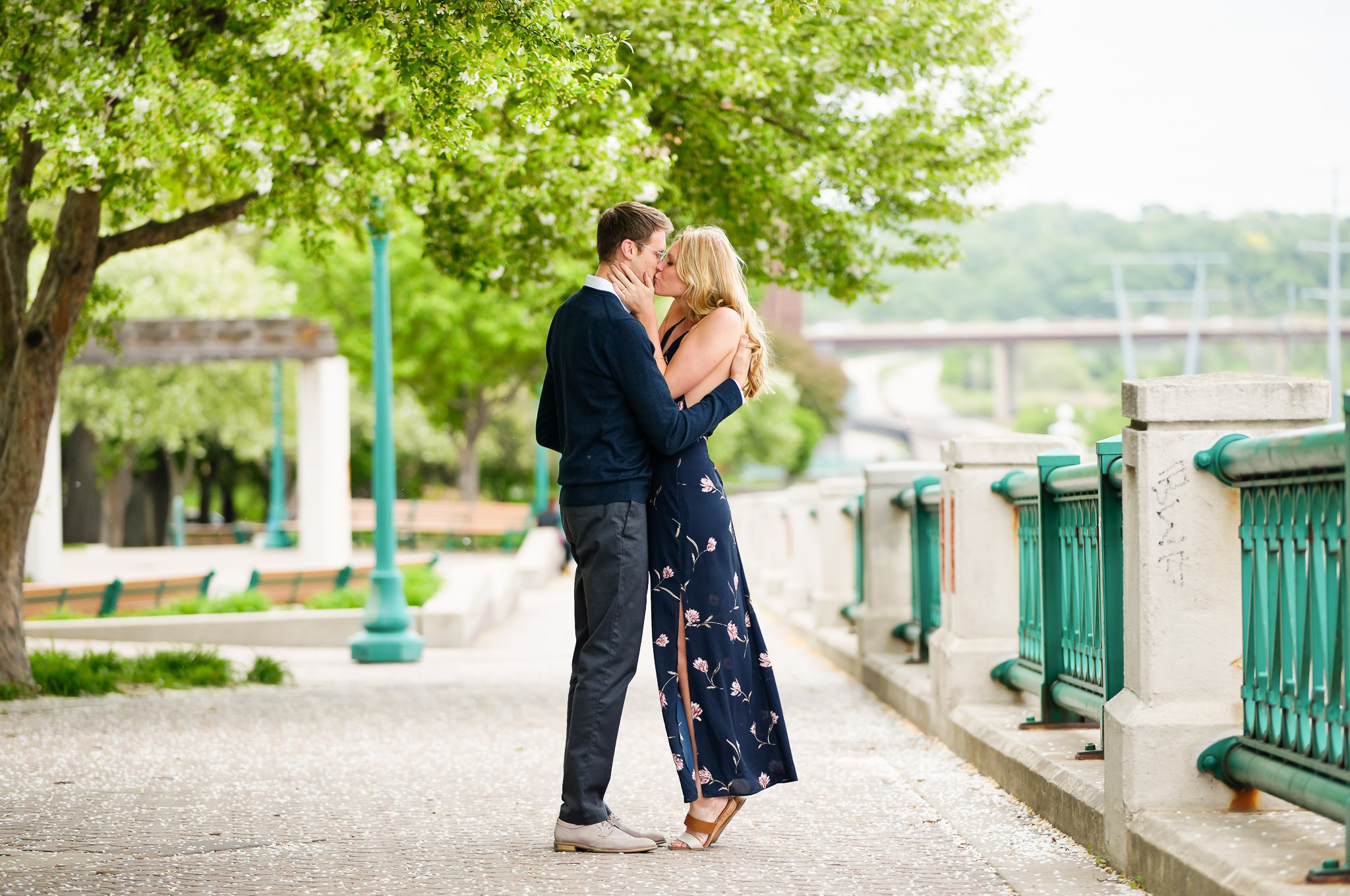 Romantic Engagement Kiss on Historic Stone Bridge