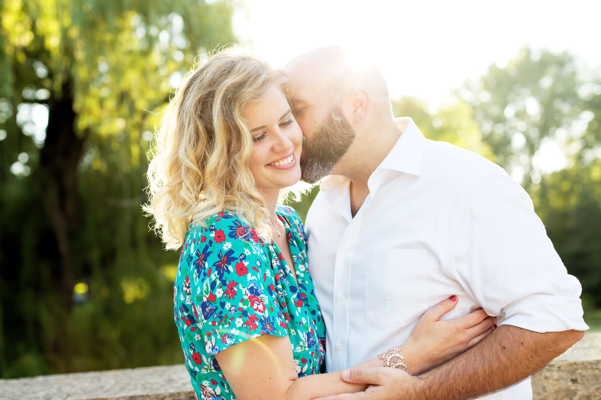 Golden Hour Engagement Photos - Couple Embracing in Sunlight