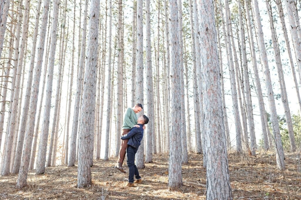 Gay Couple Engagement Session Stillwater Minnesota Forest with Pines trees