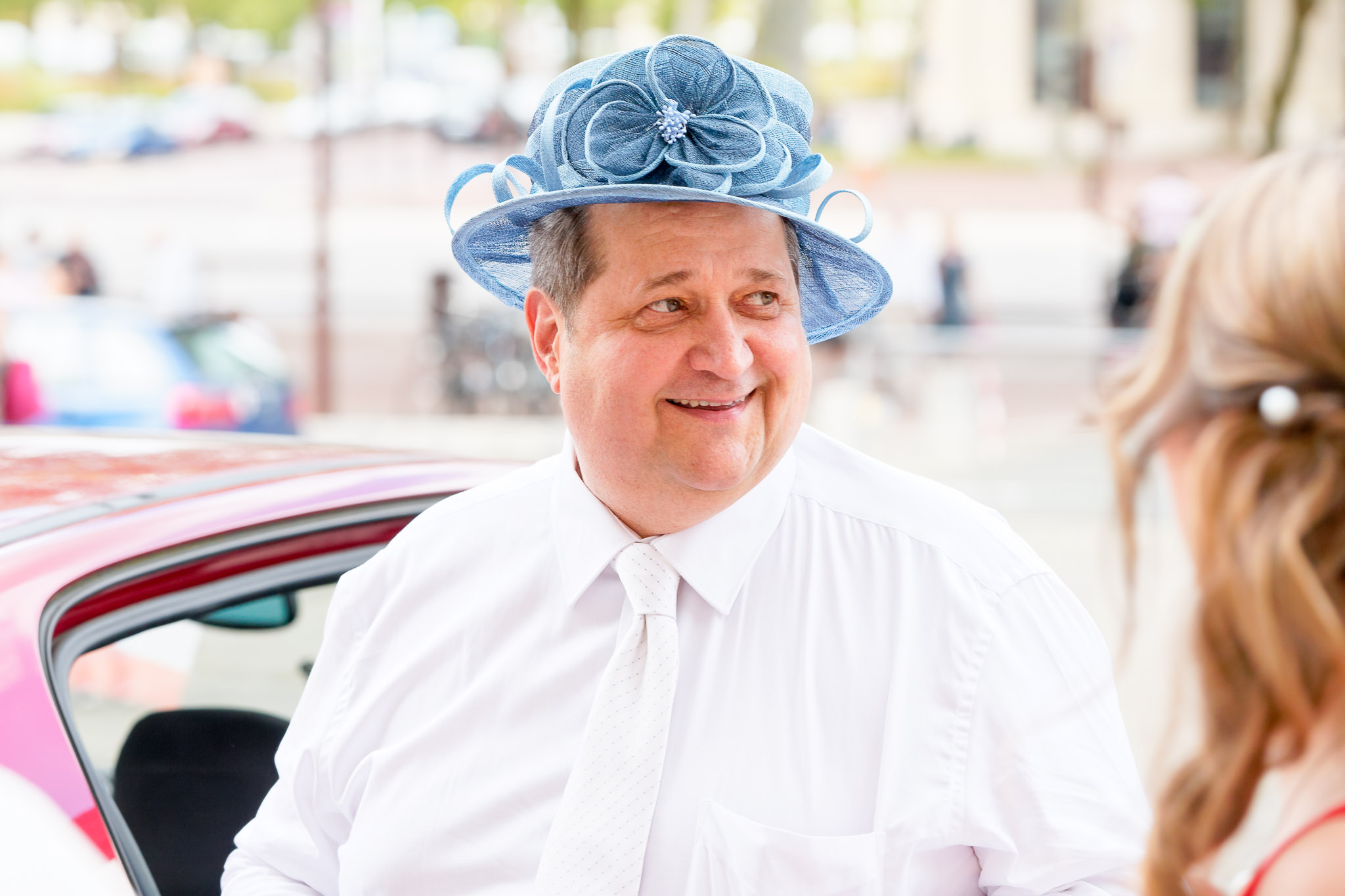Father Wearing Mother's Hat Creates Funny Wedding Moment