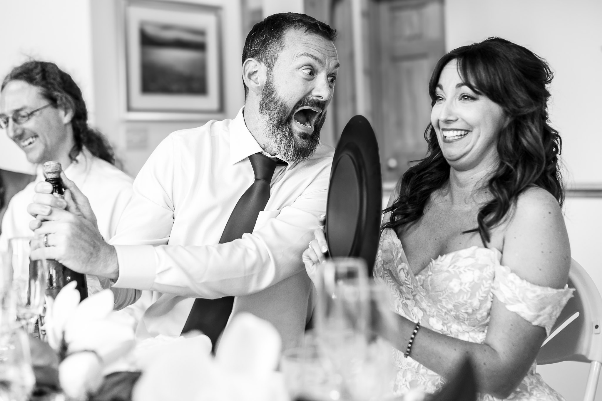 Funny Champagne Opening Moment at Lutsen Cascade Lodge Wedding
