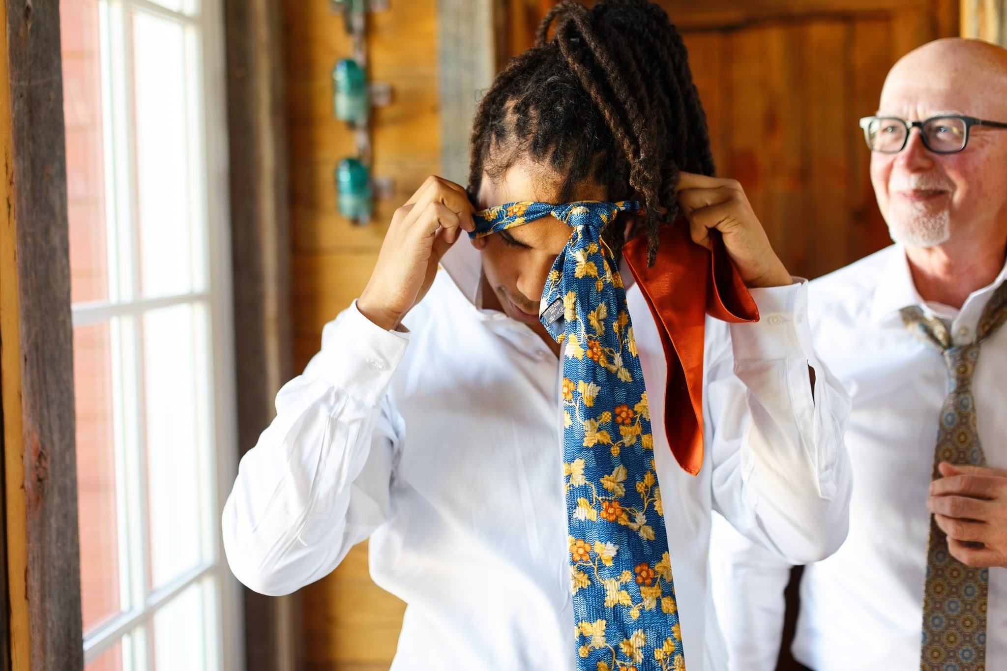 Groom Struggling with Tie - Almquist Farm Wedding Photography