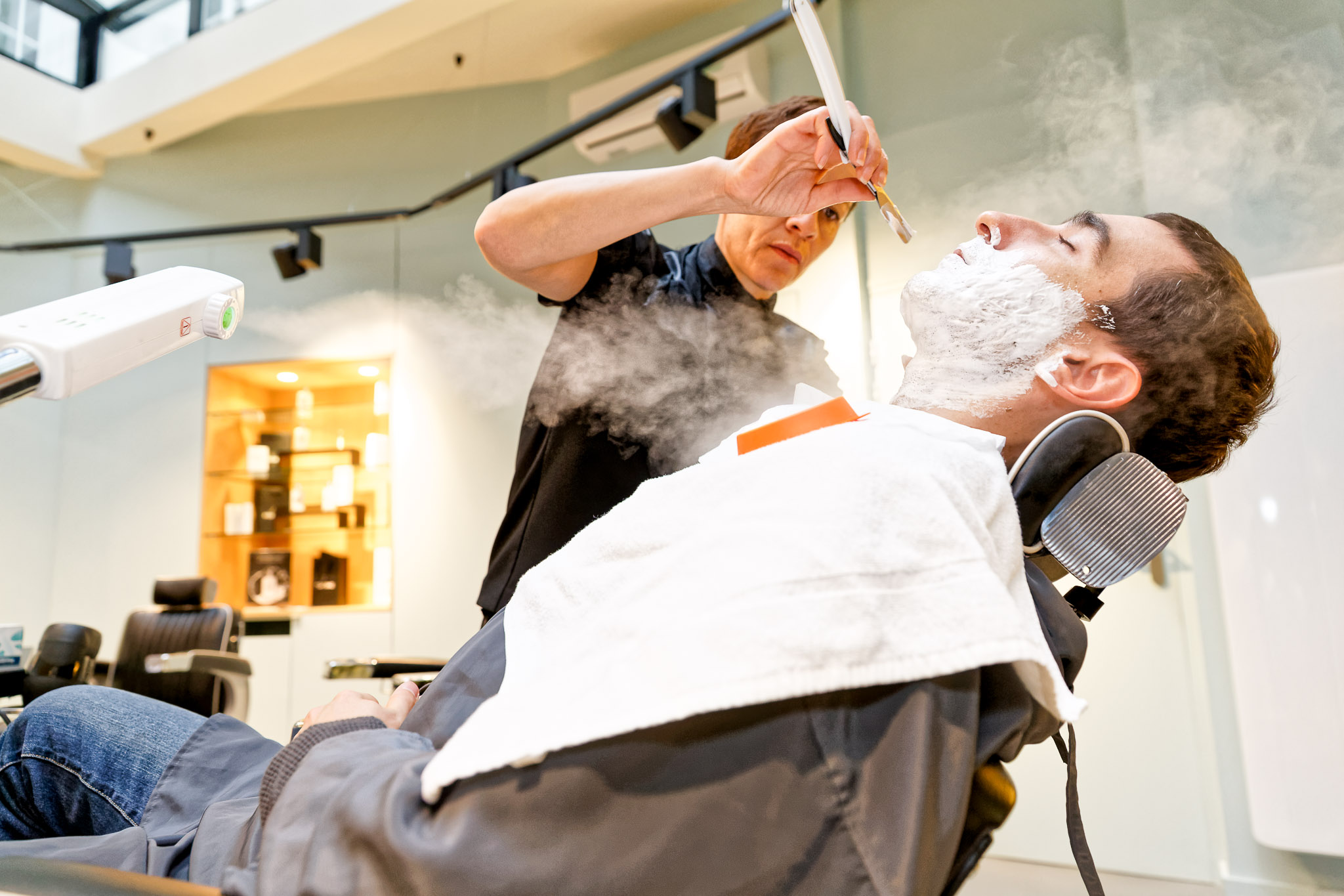 Groom's Barbershop Shave During Wedding Preparation