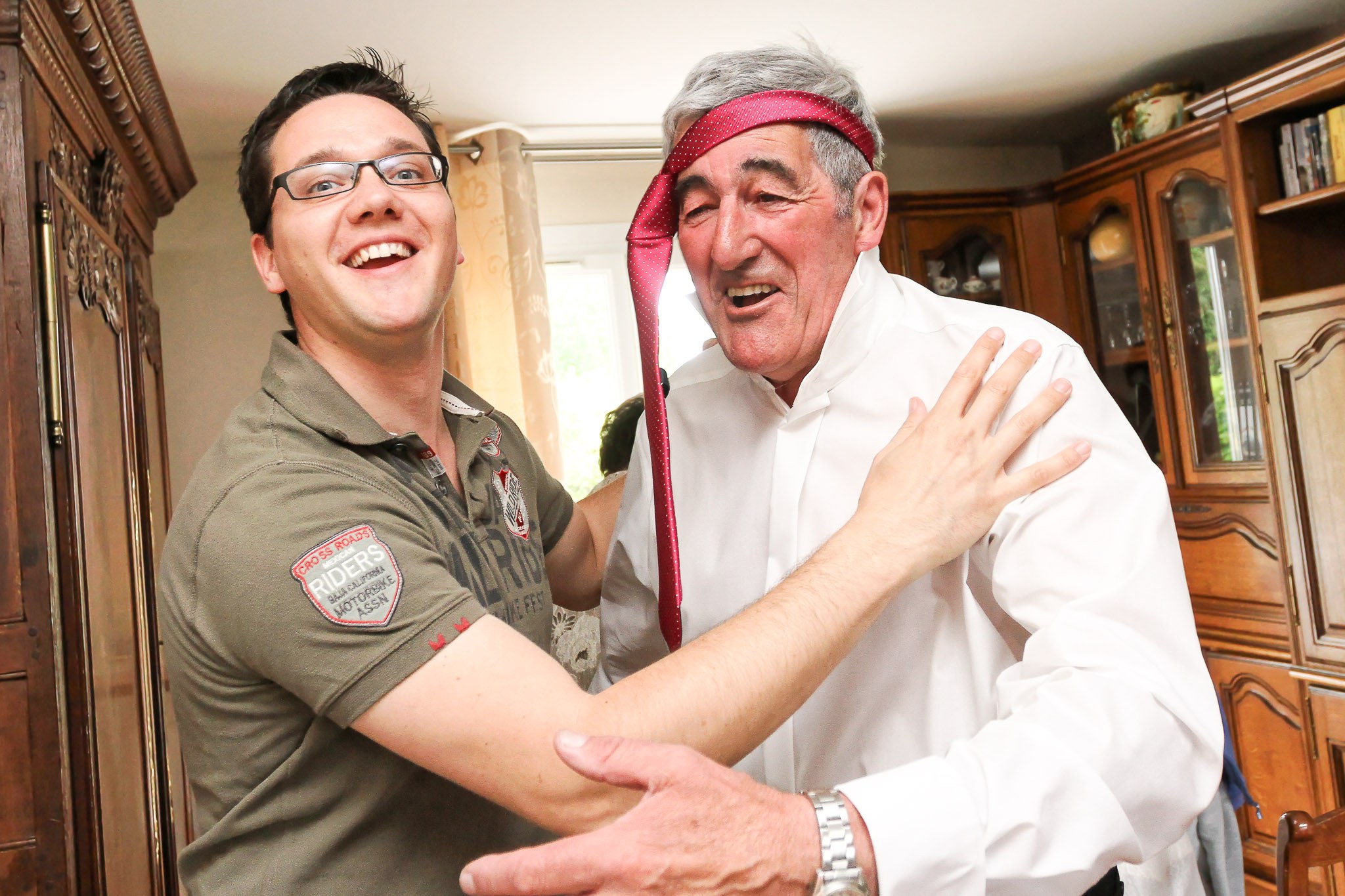 Father of Groom Playing Clown During Wedding Preparations
