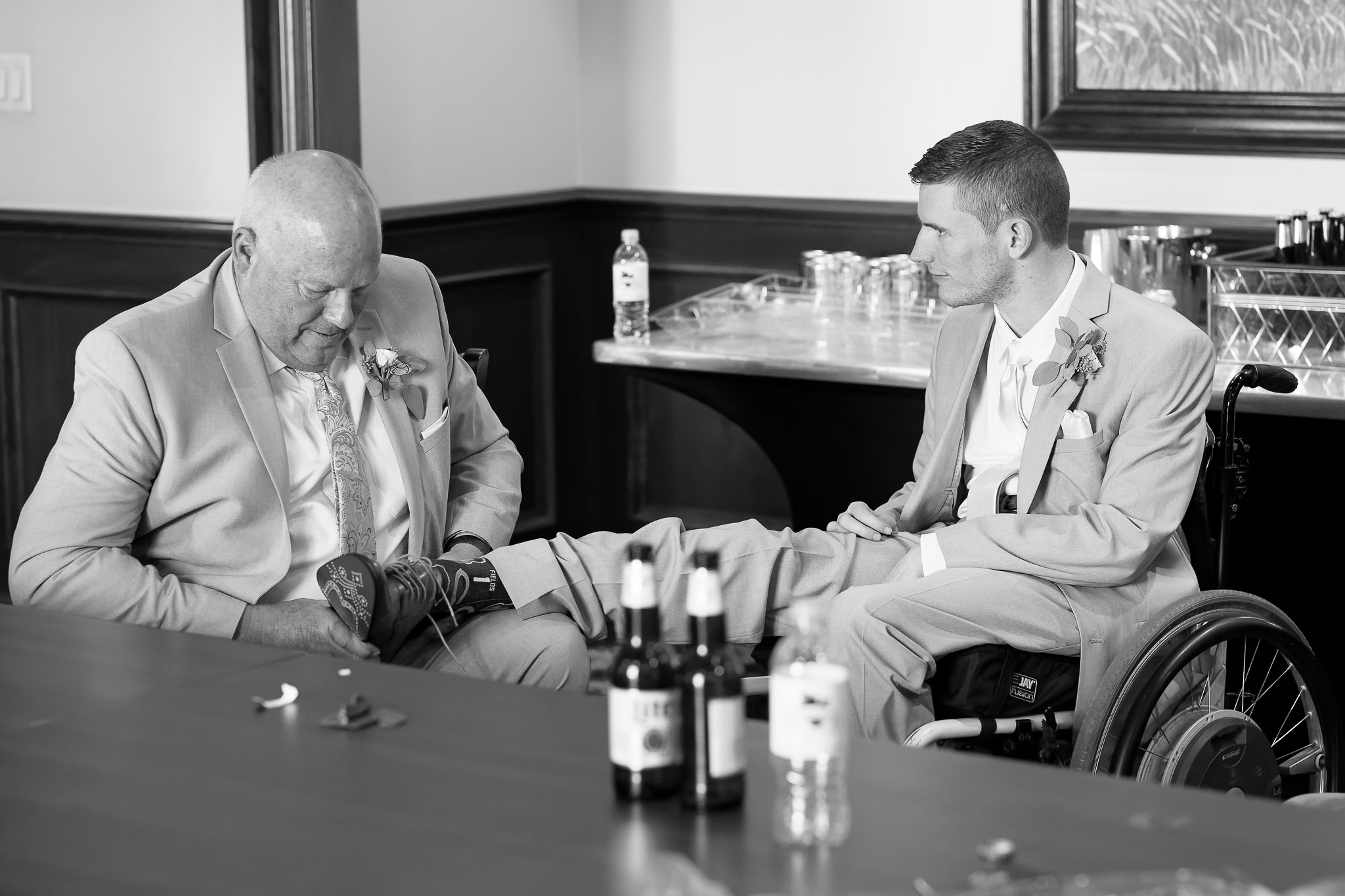 Father Helps Groom in Wheelchair Prepare for Wedding