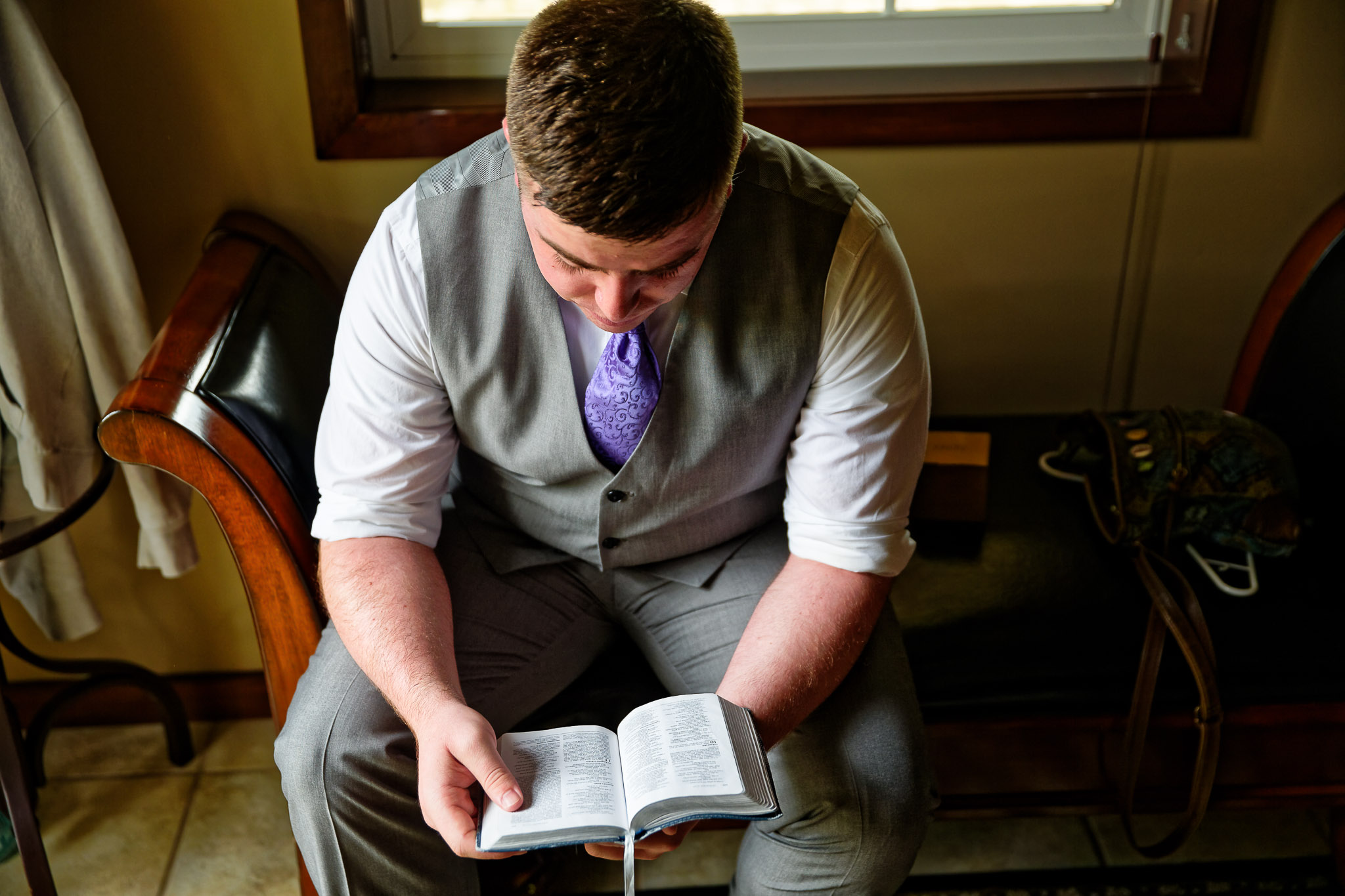 Groom Reading Bible Before Wedding Ceremony - Preparation