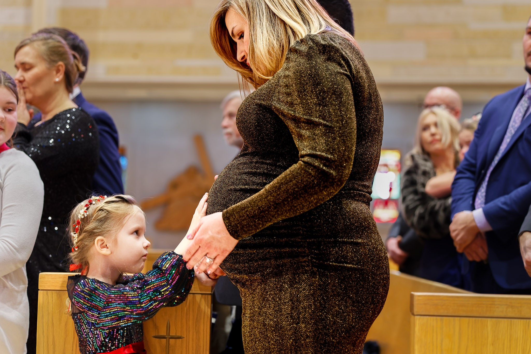 Child Touches Pregnant Mother's Belly During Wedding Ceremony