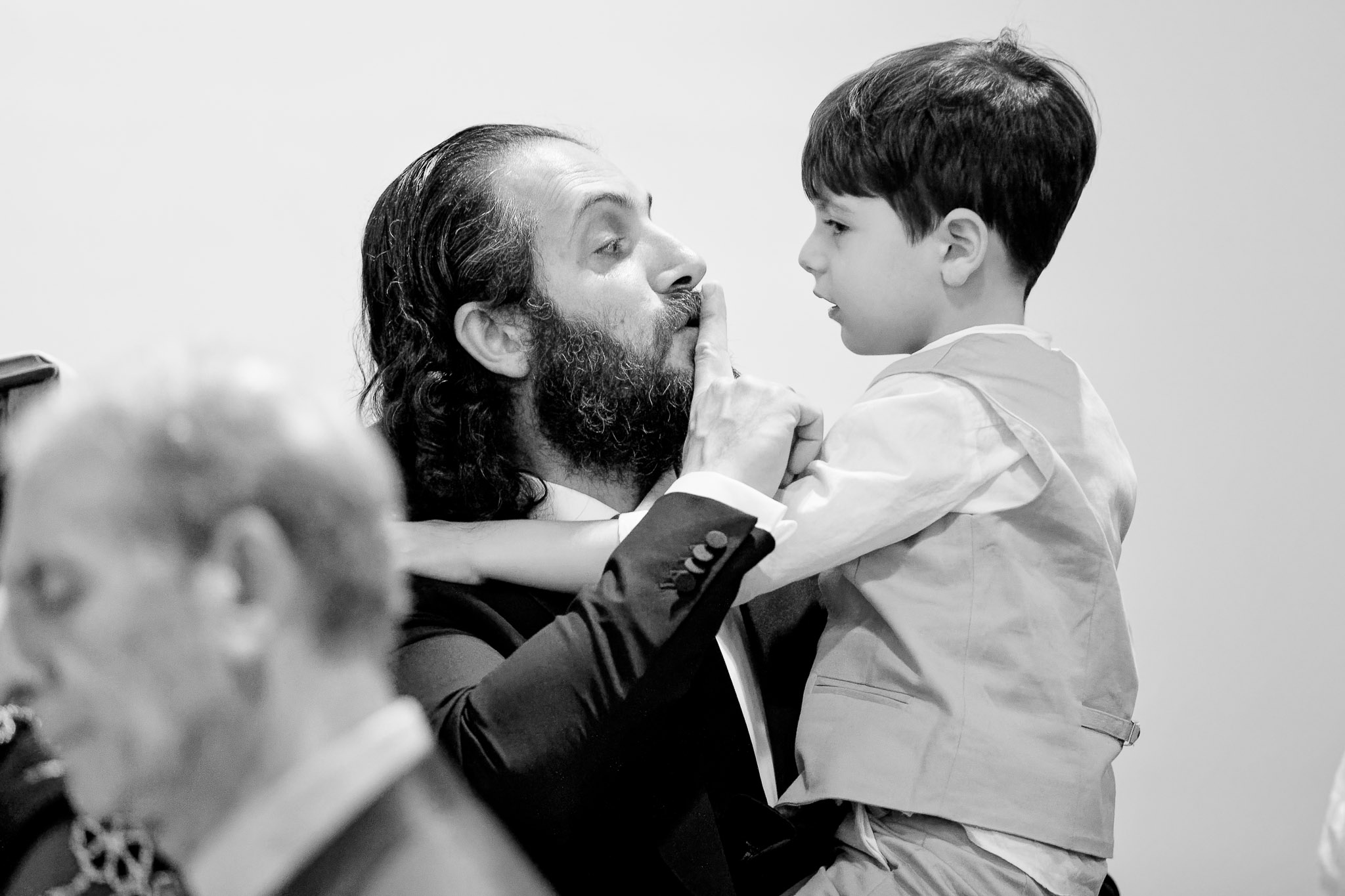 Father Shushing Child During Wedding Ceremony