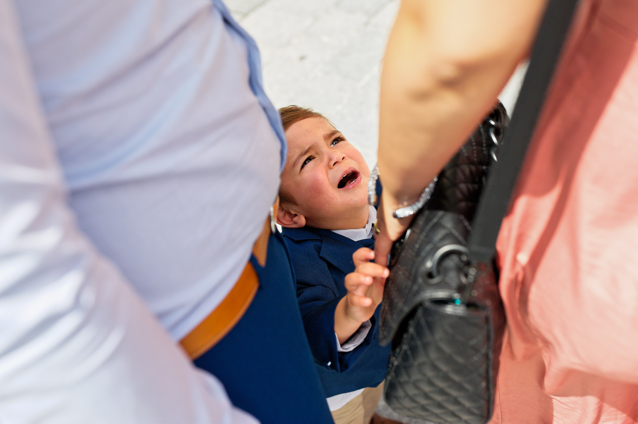 Child Whining for Mother's Purse During Wedding Reception