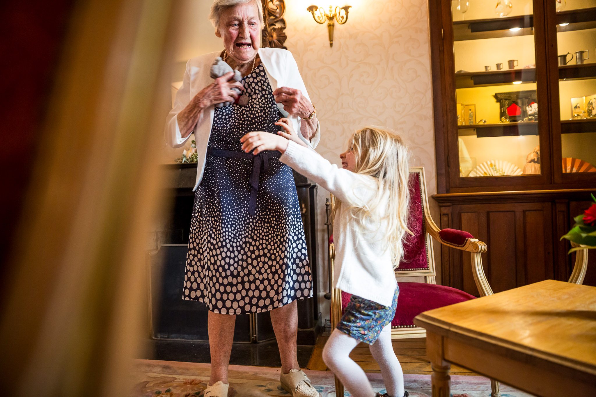 Grandmother Pretends Fear as Child Claims Teddy Bear at Wedding