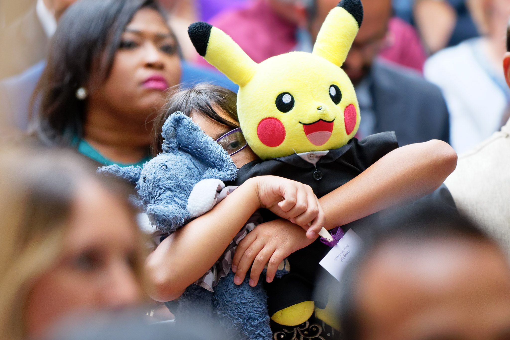 Child Hides Behind Pikachu During Wedding Ceremony