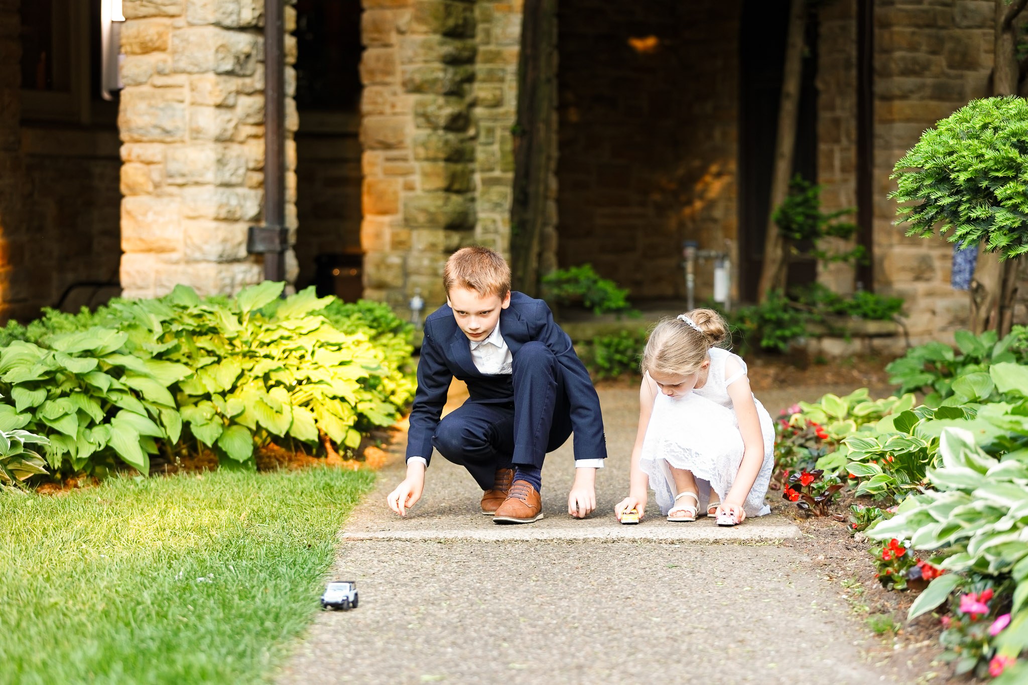 Kids Playing During Wedding Cocktail Hour at Pond View Barn