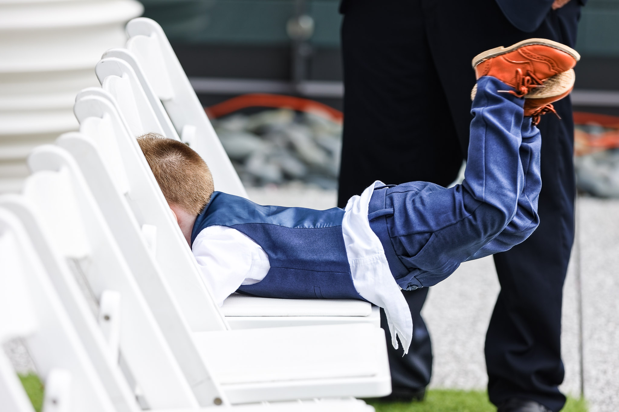 Child Playing on Chair During Wedding Reception Rochester MN