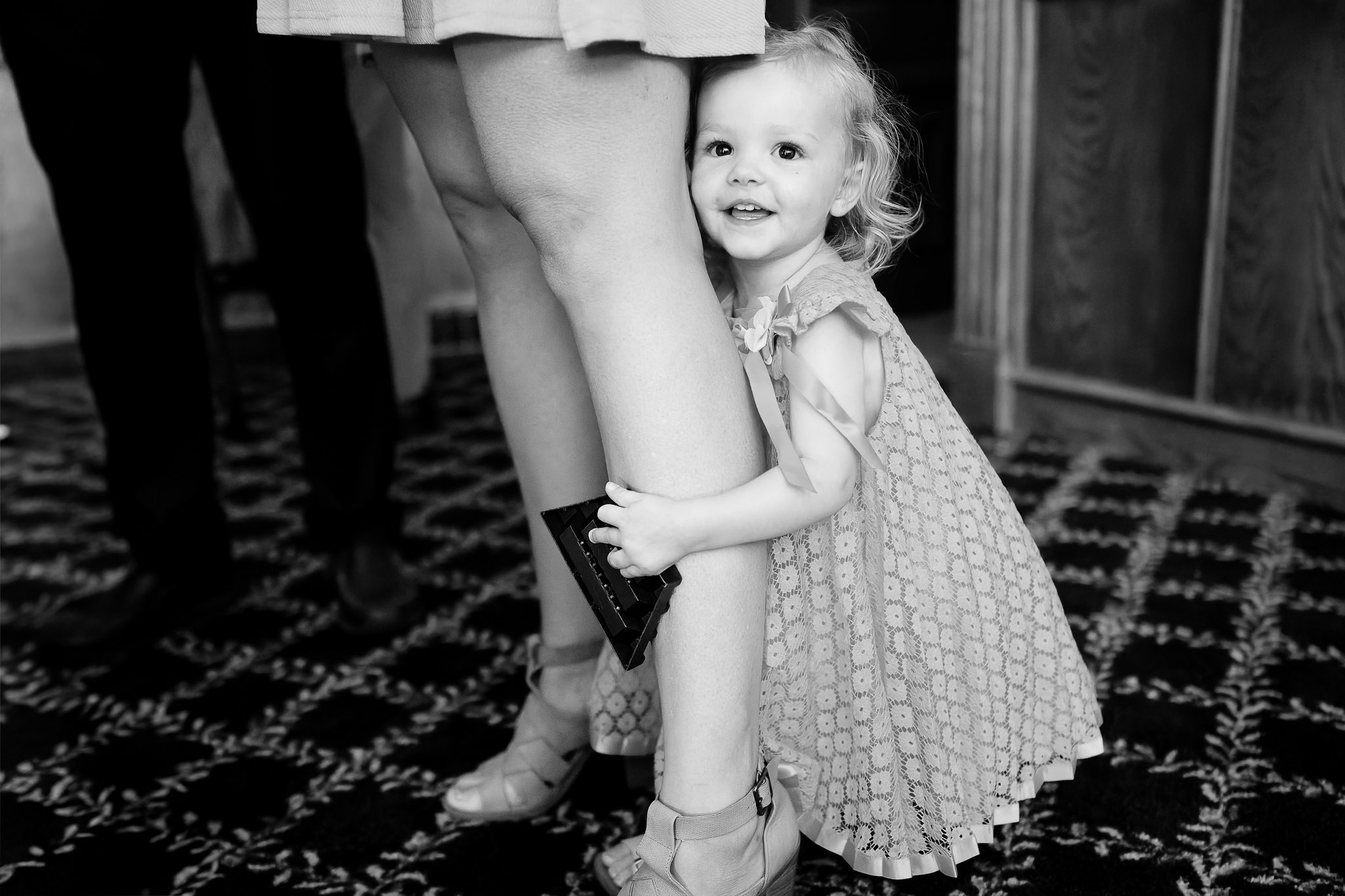 Toddler Hugs Mom's Leg During Wedding Reception Byron MN