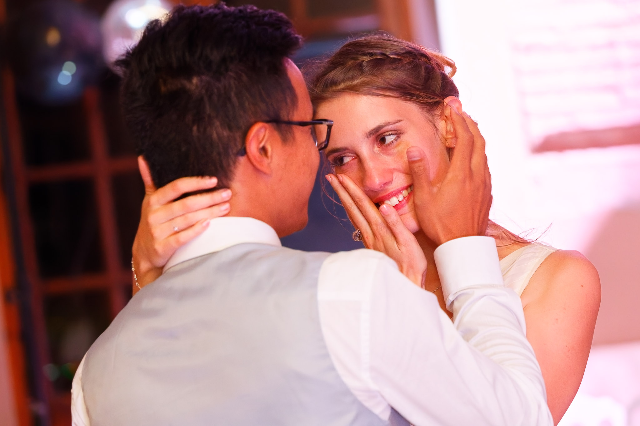Groom Comforts Crying Bride on Wedding Dancefloor