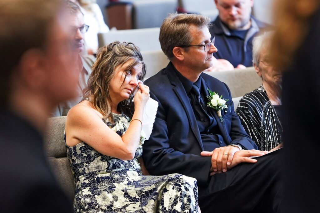 Emotional Wedding Guests Crying During Church Ceremony