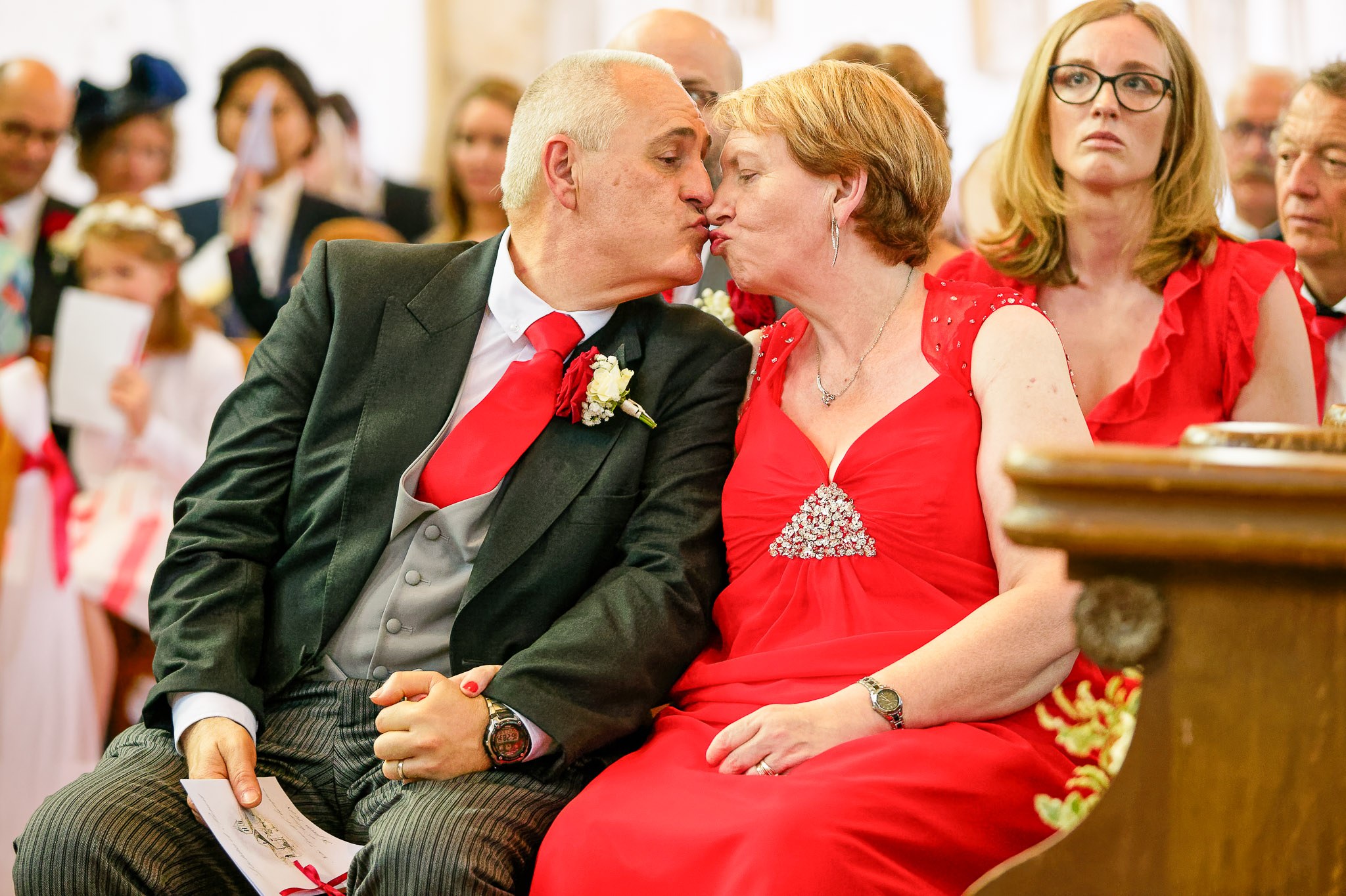 Parents Kiss During Wedding Ceremony - Emotional Family Moment