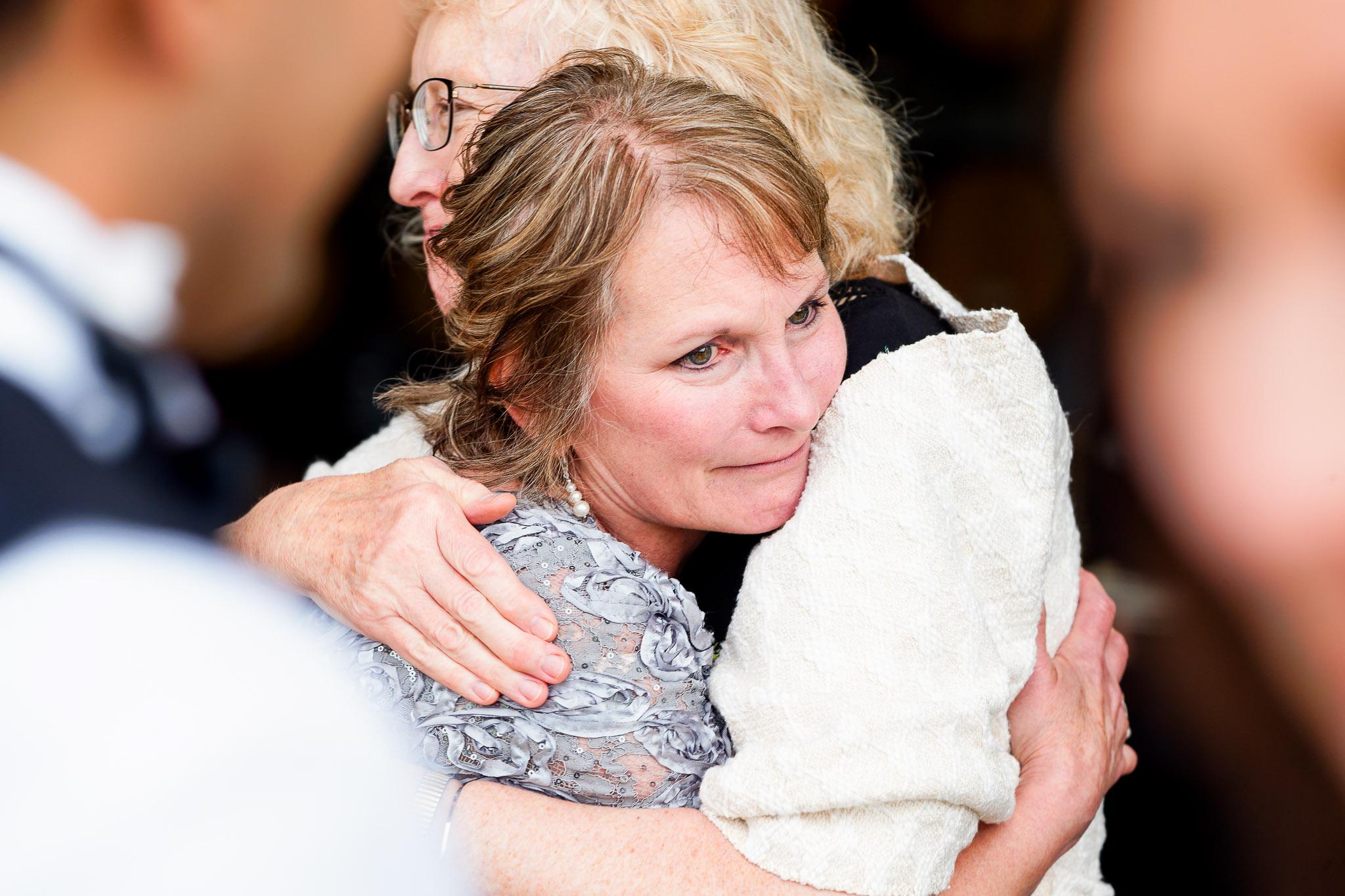Emotional Parents Embrace at Four Daughters Vineyard Wedding