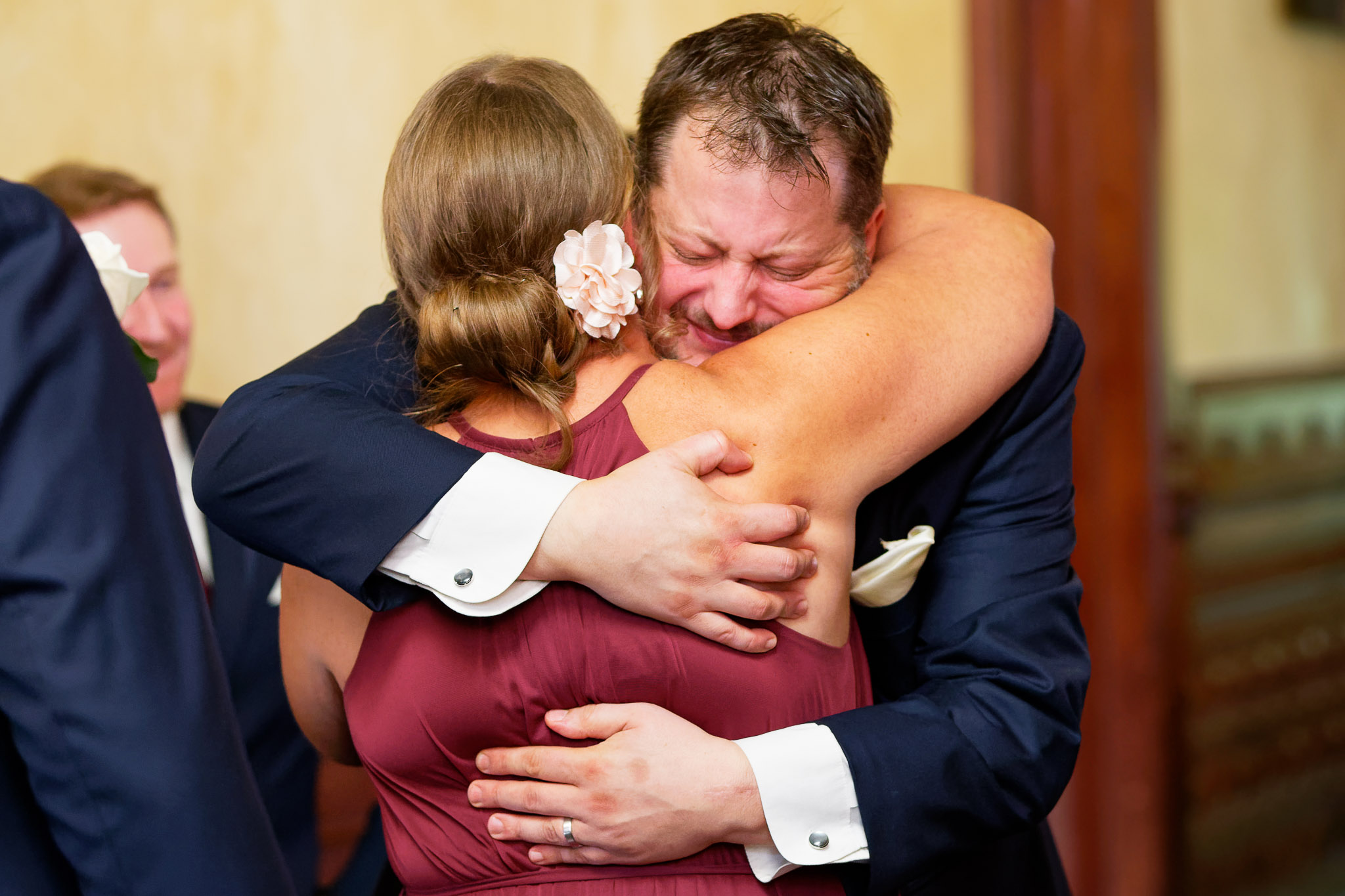 Groom Crying After Ceremony Hugging Bridesmaid Wedding Photo