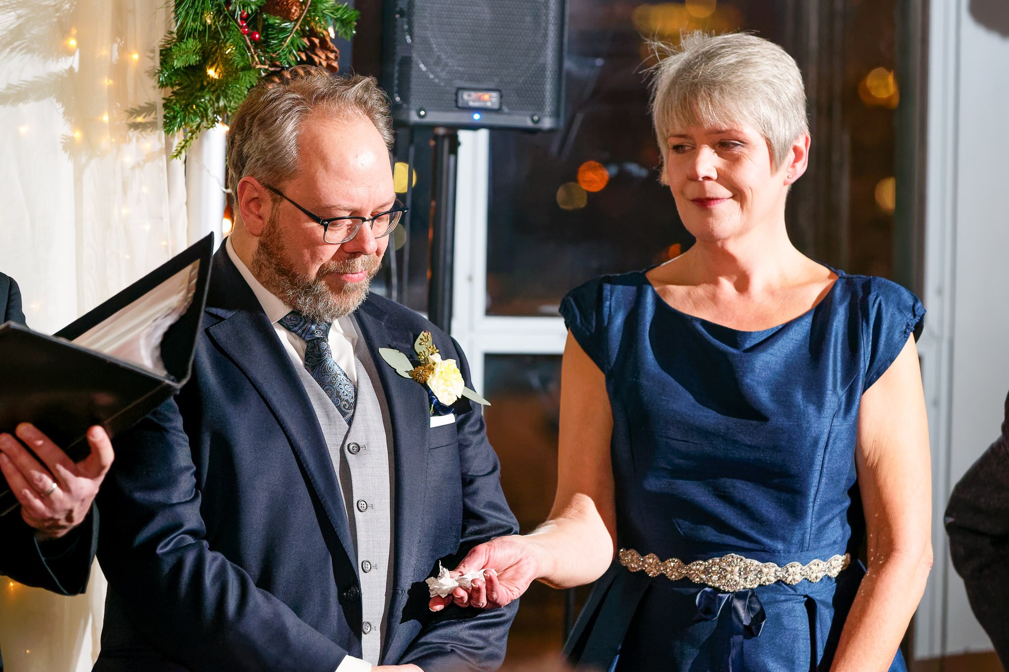 Maid of Honor Comforts Groom During Winter Wedding Ceremony