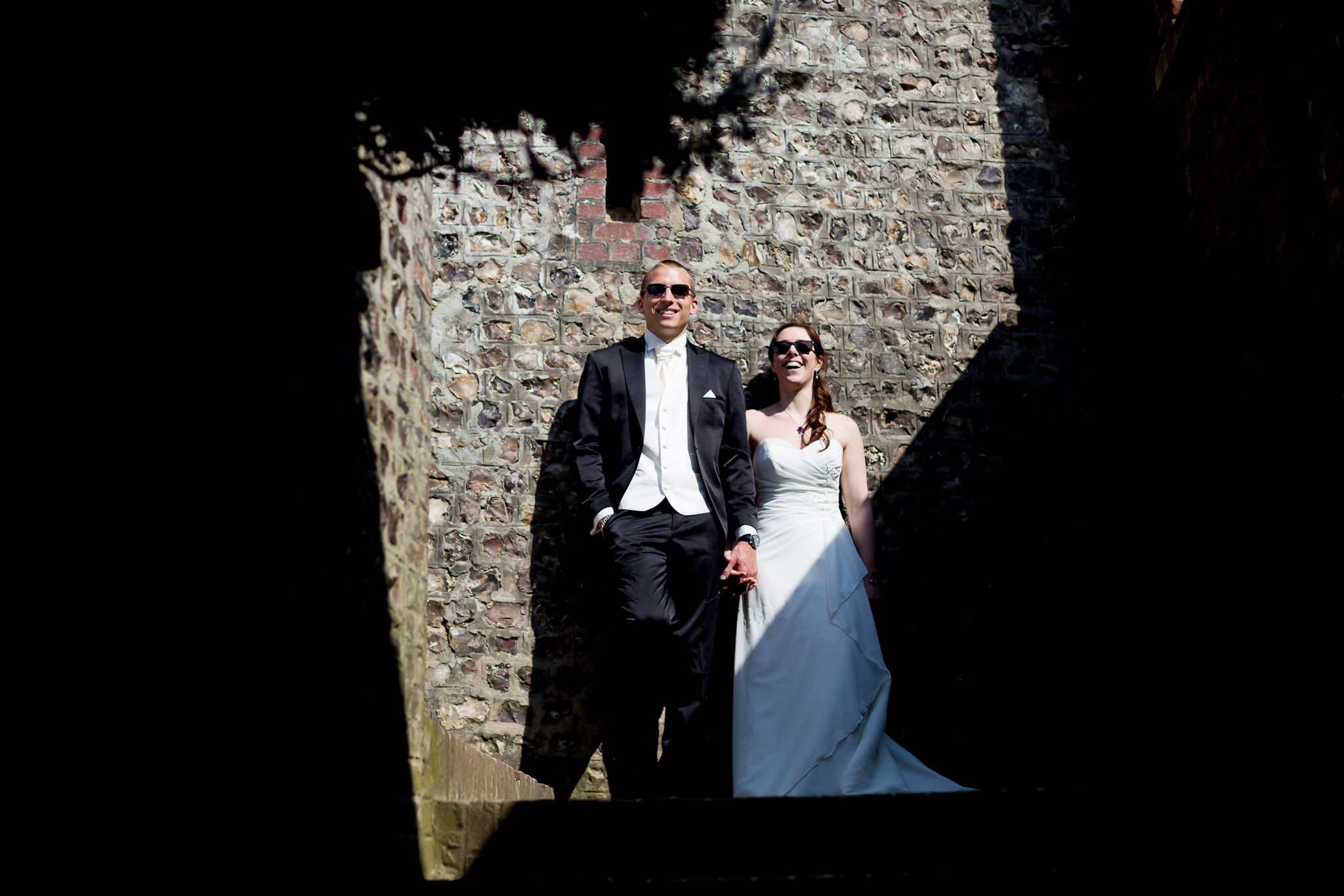 Dramatic Sunlight Wedding Portrait in Stone Ruins