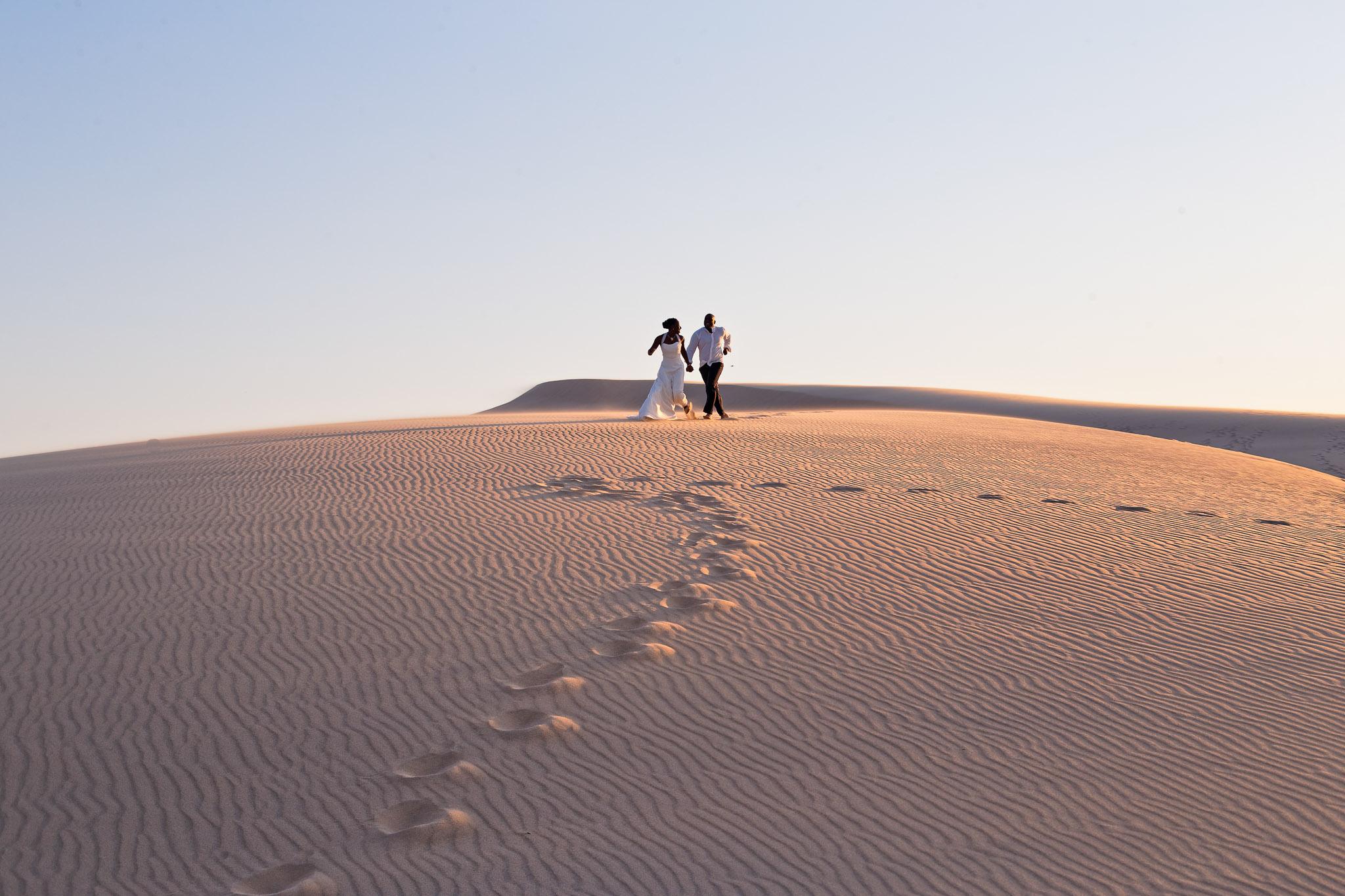 Desert Trash the Dress Session - Couple Running on Sand Dunes