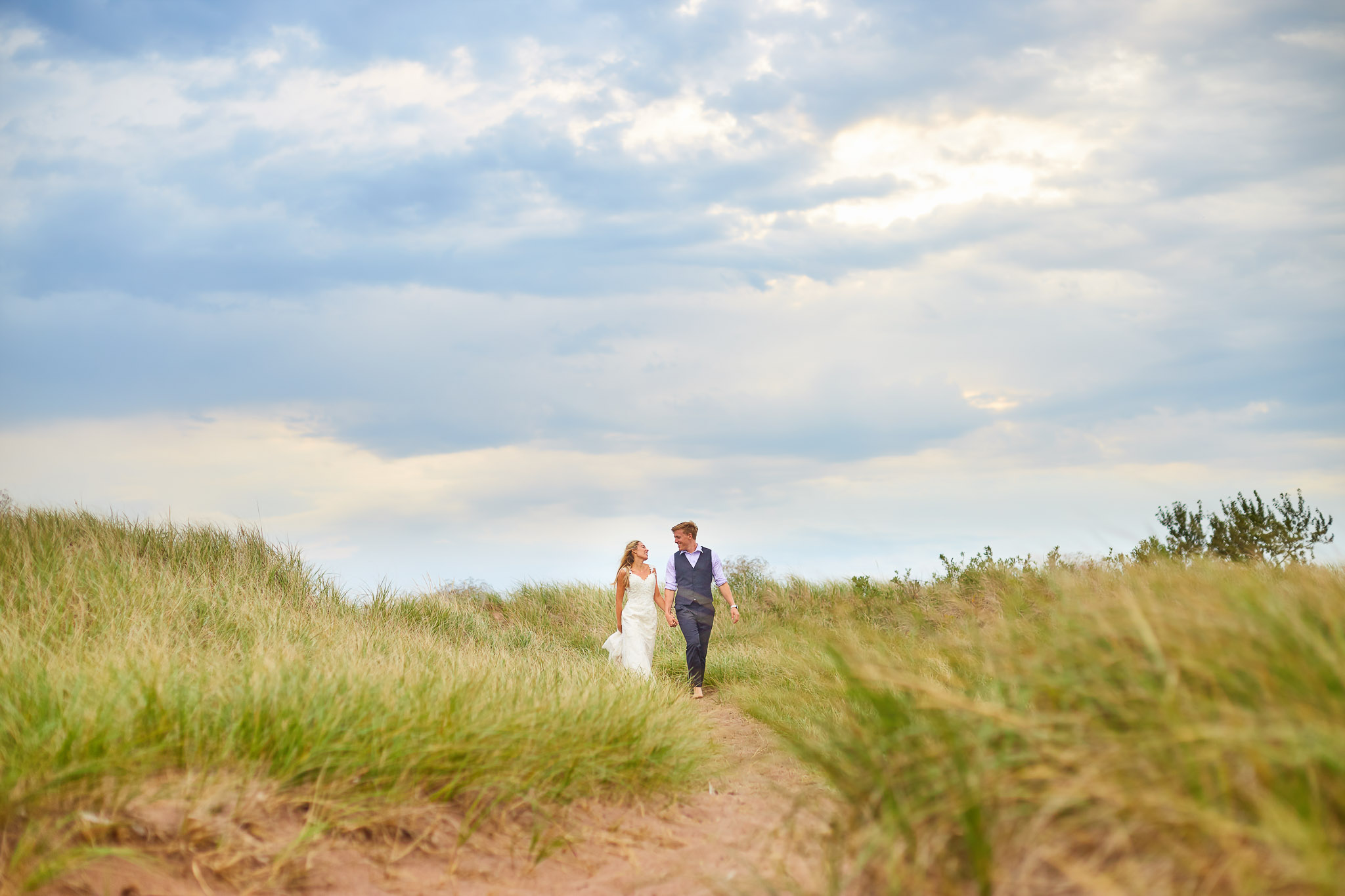 Trash the Dress Beach Session - Couple Walking Through Dunes