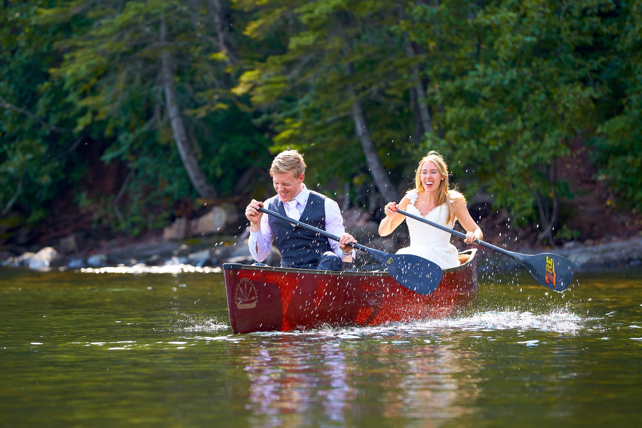 Newlyweds Canoeing in Wedding Attire - Trash the Dress Session