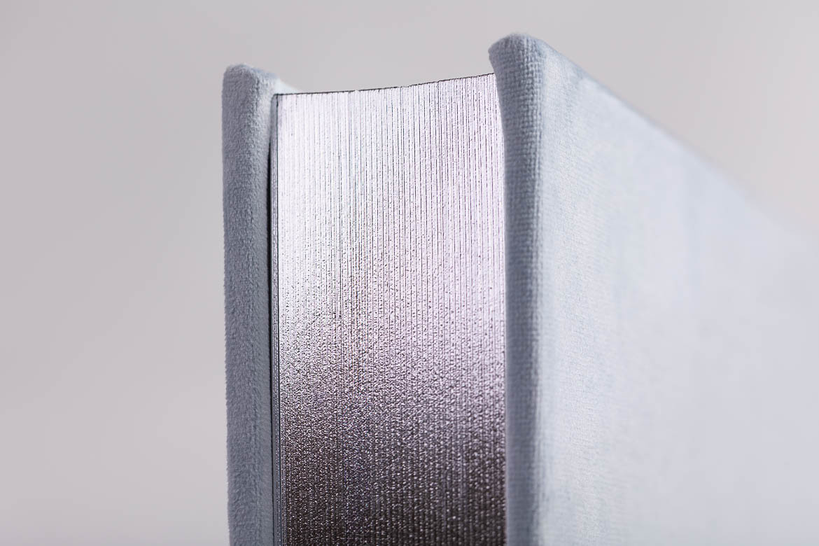 Silver Gliding edge on light blue velvet album
